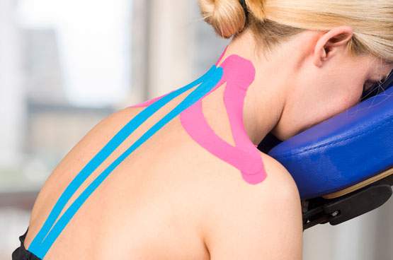 kinesio taping on neck, shoulders, and spine